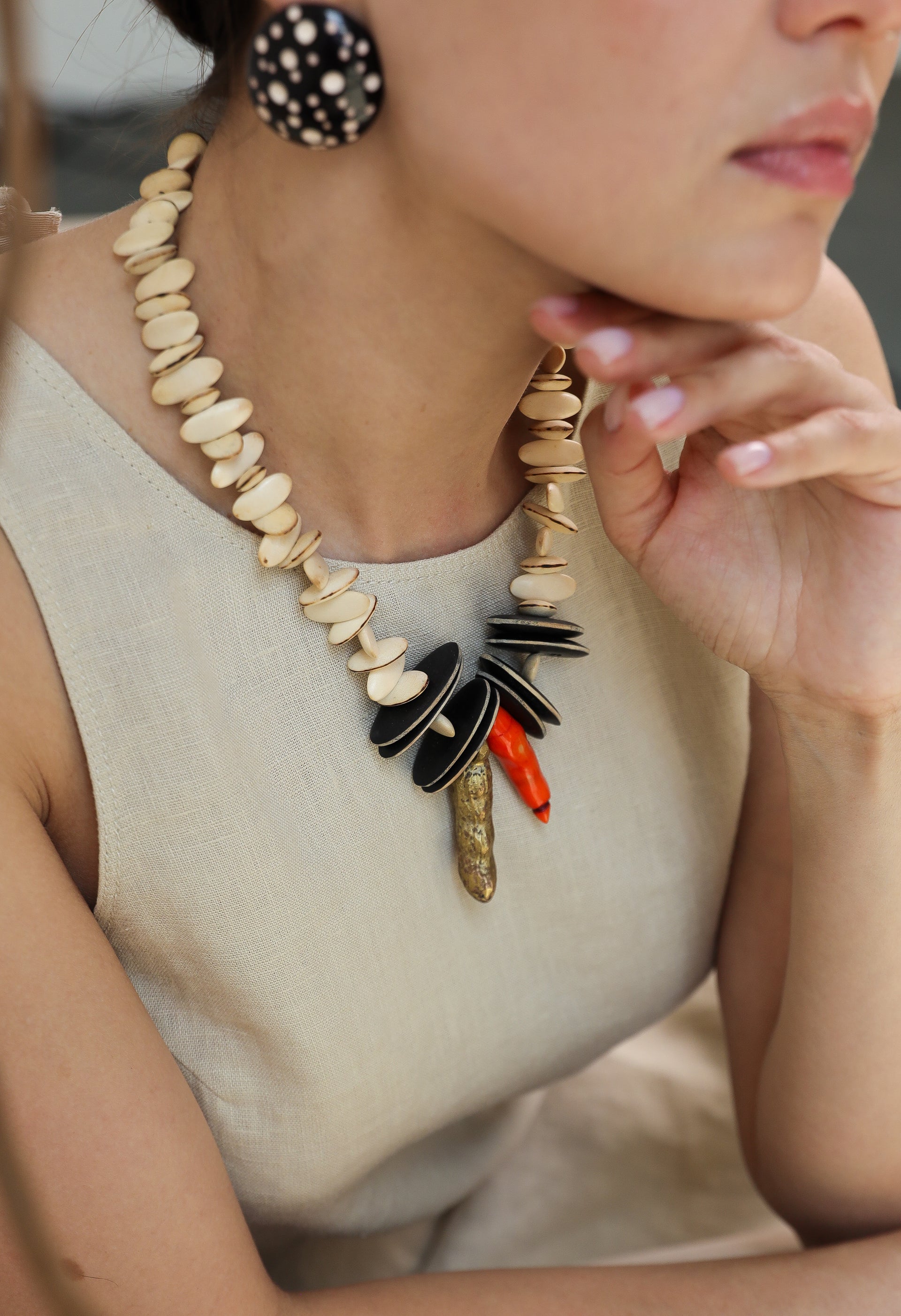 Pina Necklace. Wood, African bronze , dyed trunk coral.